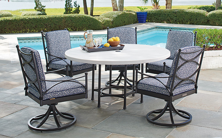 Outdoor dining scene featuring dining chairs and table.