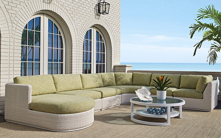 Ocean Breeze Promenade scene featuring sectional, coffee table and end table.