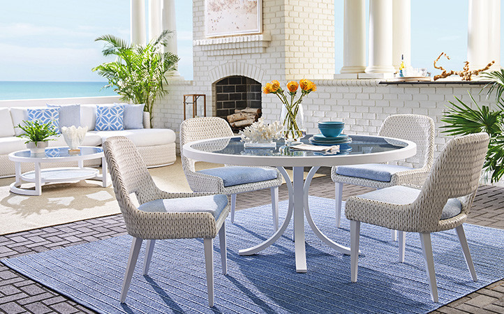 Ocean Breeze Promenade scene featuring dining table with chairs.
