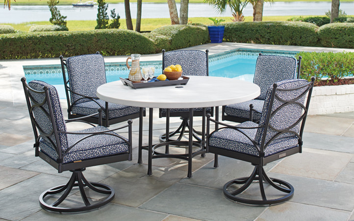 outdoor dining setting with 4 chairs and a round table