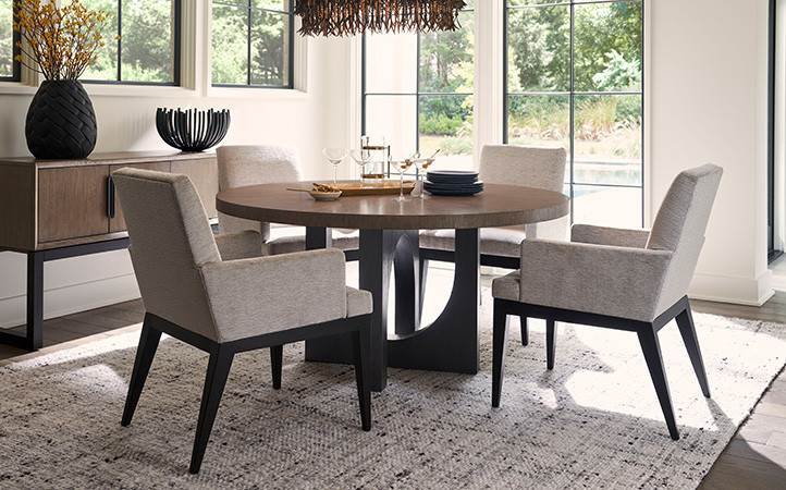 The Regent round dining table offers a bold contemporary statement with its juxtaposed U-shaped bases in the Tunis finish.